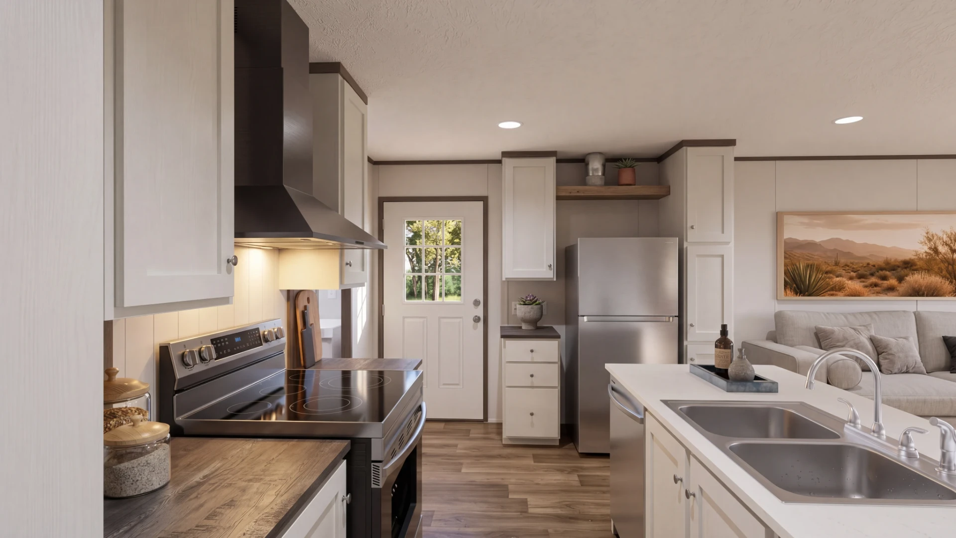 Cocina con estufa y campana extractora en la casa móvil nueva Clara 16x56