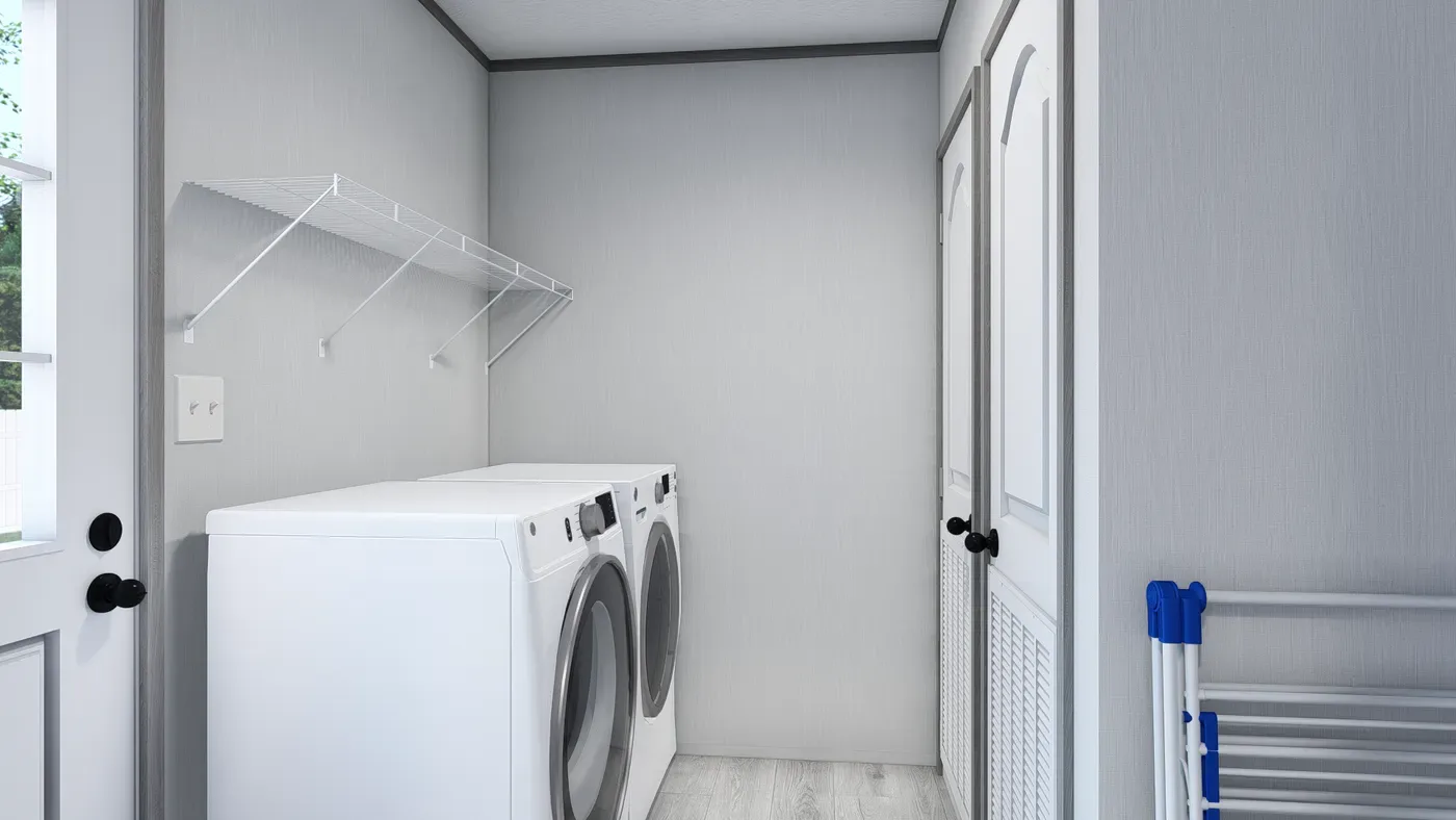 Cuarto de servicio de la casa móvil Lewis 28x62 con espacio para lavadora y secadora